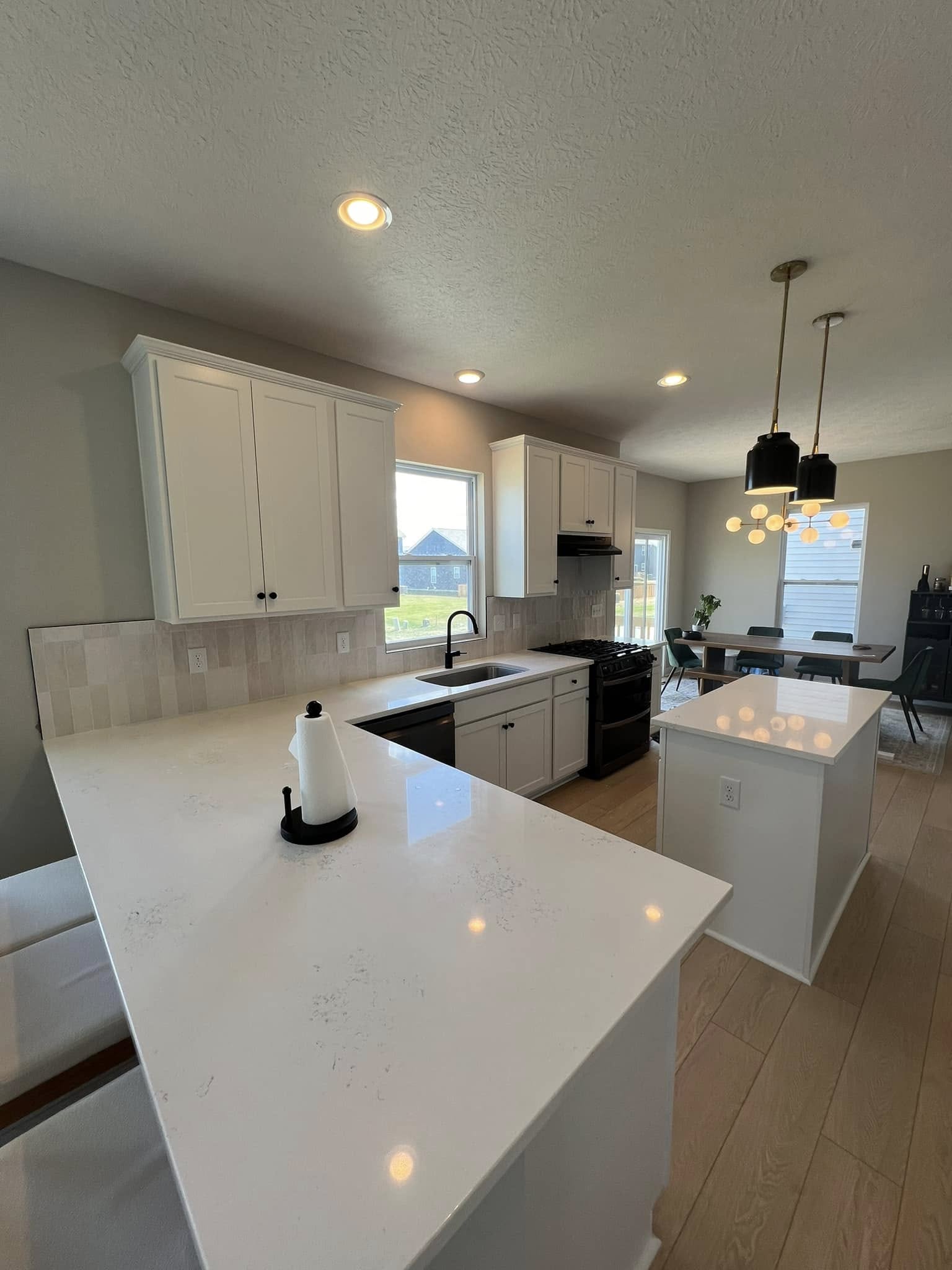 Kitchen with custom tile backsplash